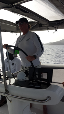 Kevin Regan at the catamaran helm